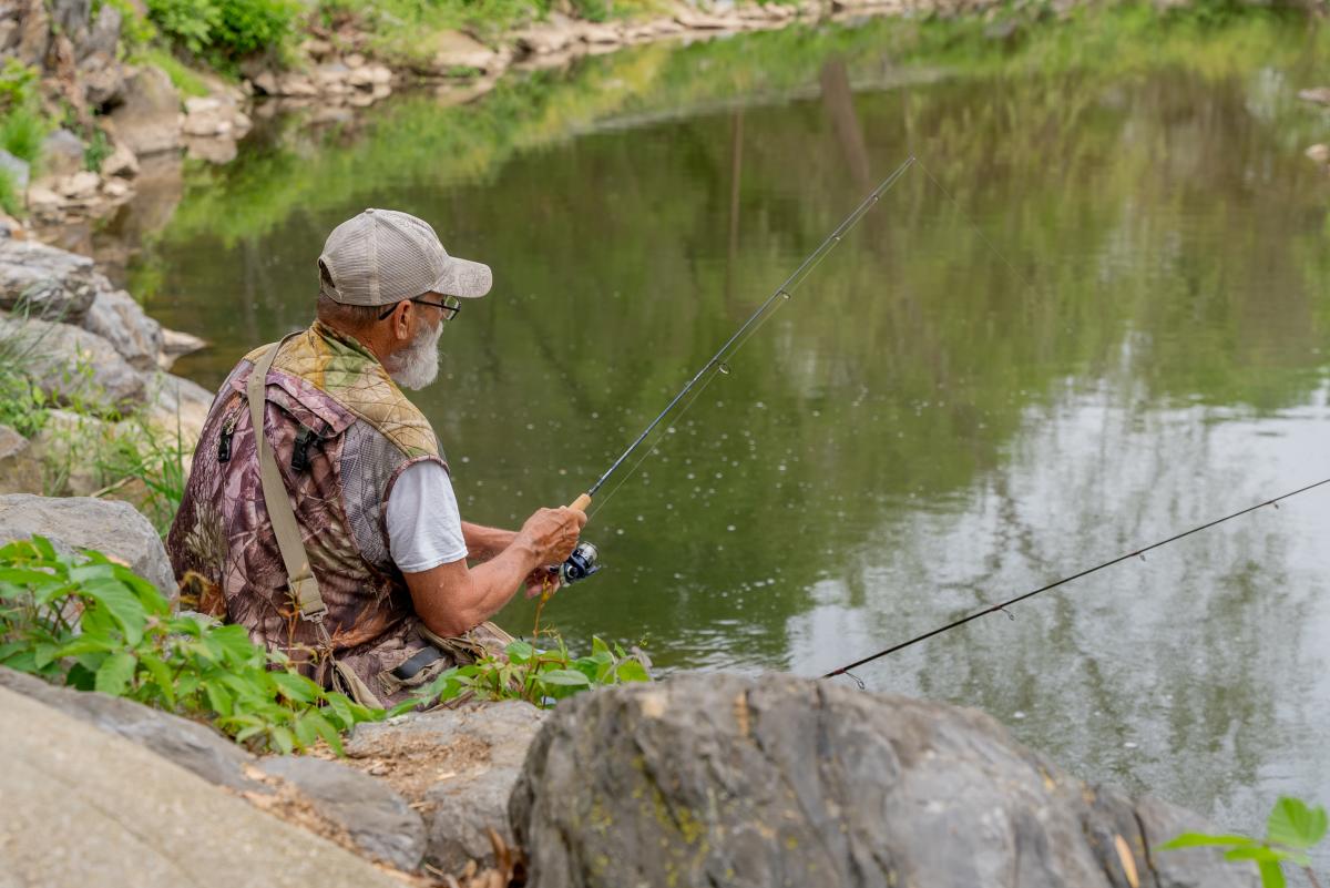Fishing along Hawksbill Creek in Luray