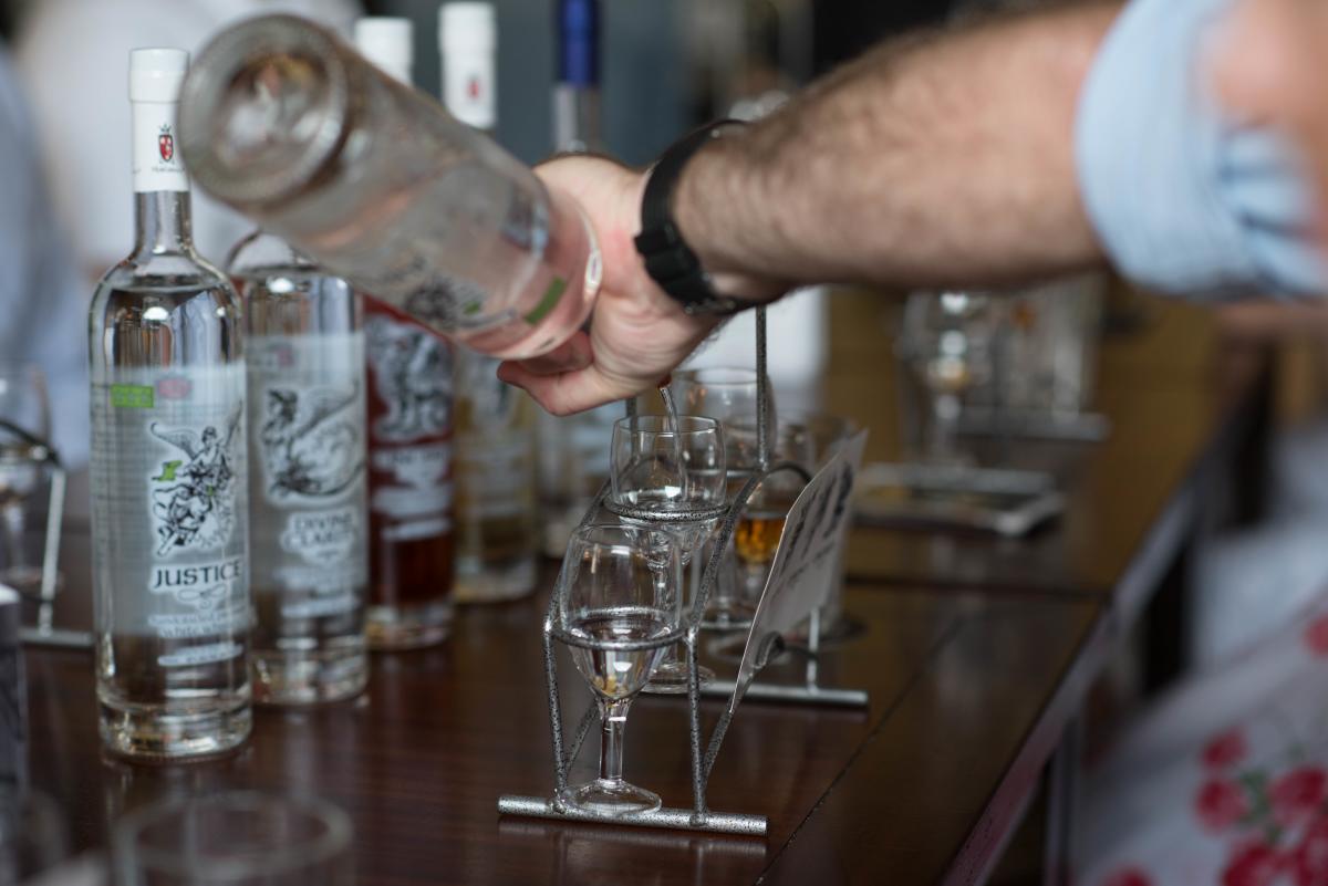 A bartender pouring drinks