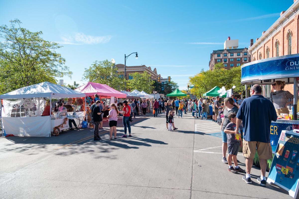 vendor booths on the street selling goods at the great downtown pumpkin festival in rapid city, sd