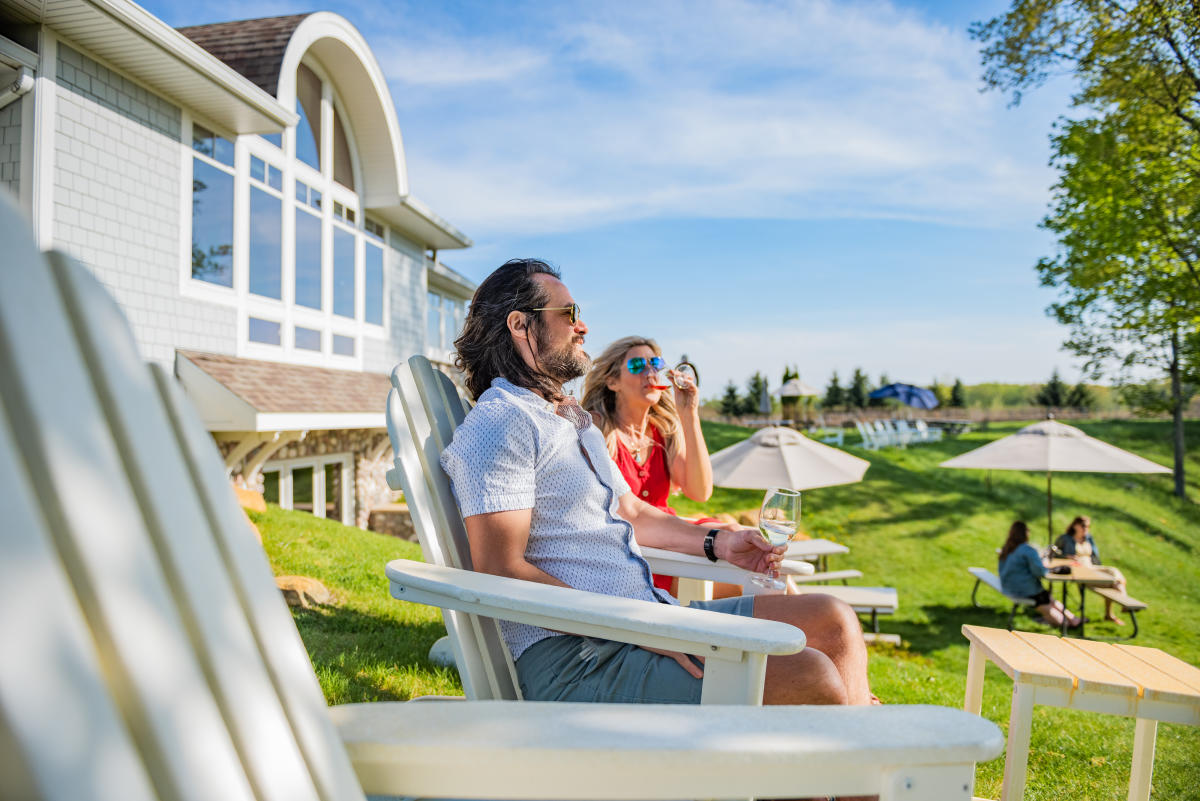 Couple sitting outside Hawthorne Vineyards