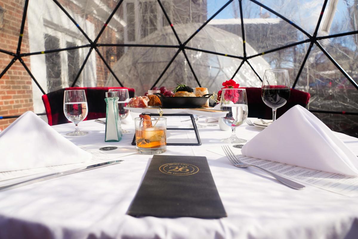 A table set for igloo dining at The Queensbury Hotel