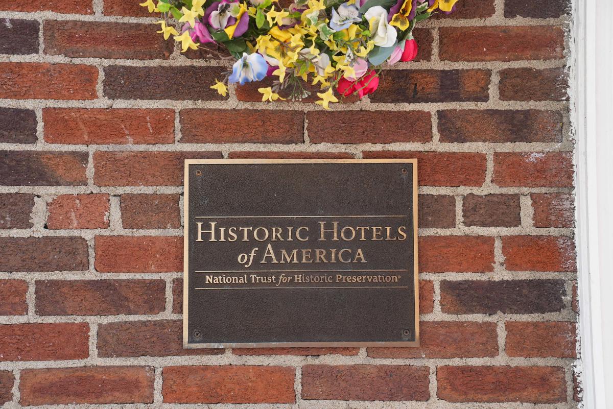 Historic Hotels of America plaque on The Queensbury Hotel