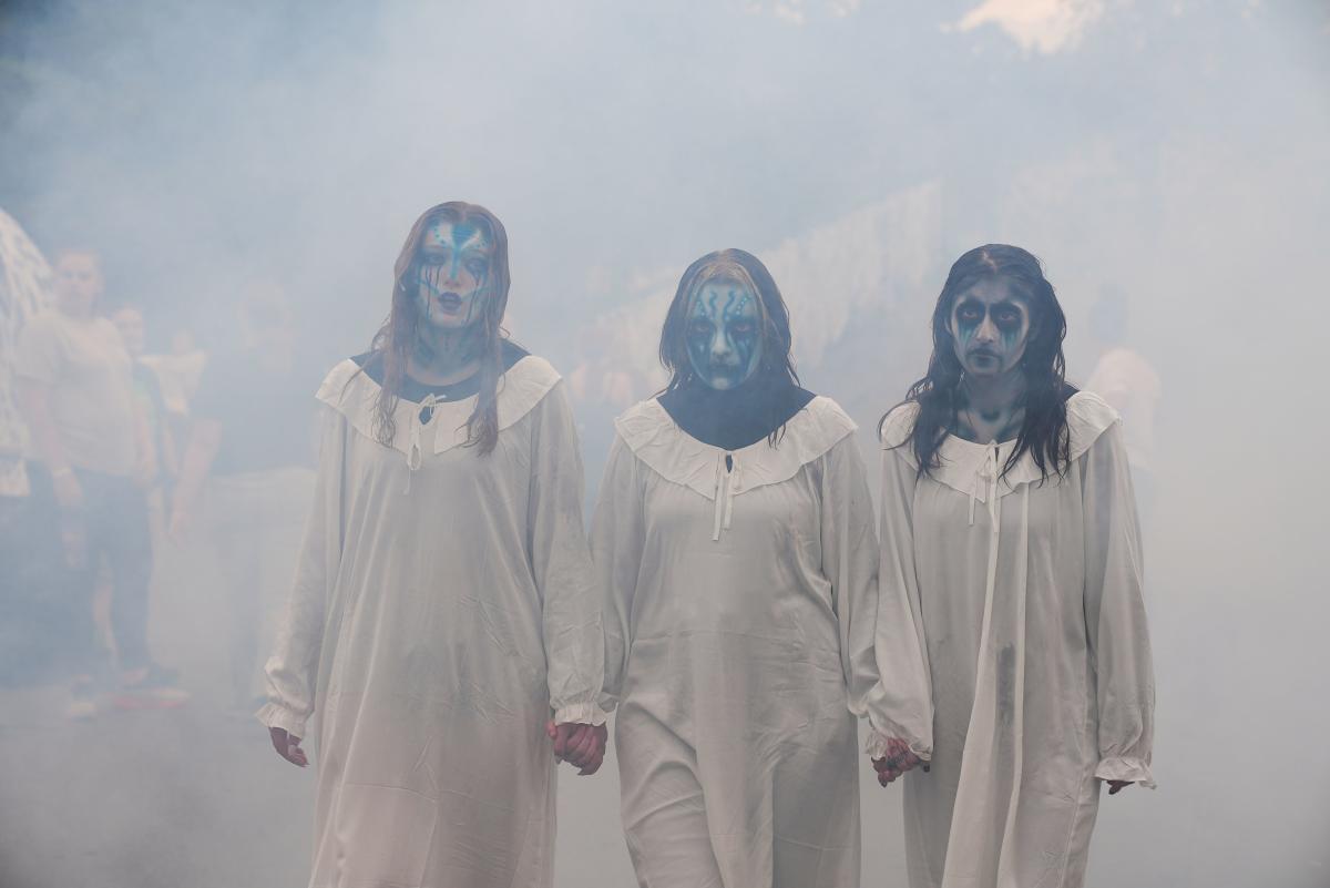 Ghost choir singing and walking through fog at Fright Fest