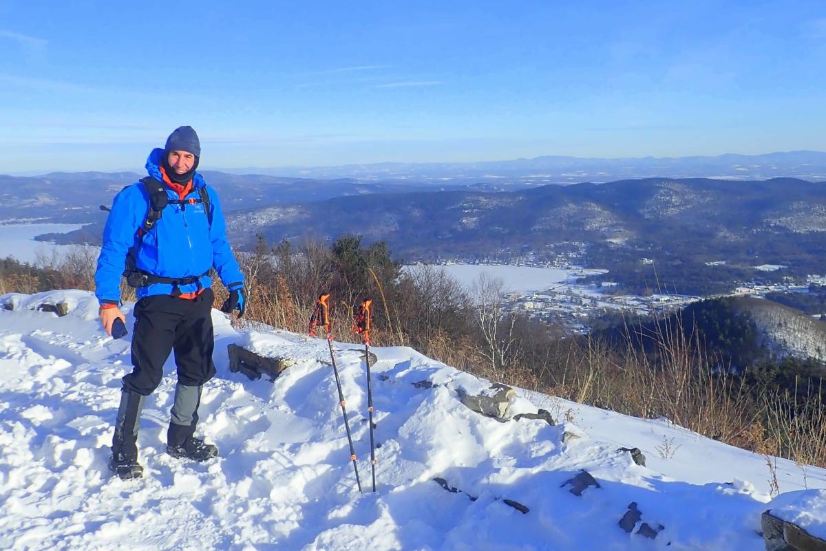 Man on Prospect Mountain summit in winter