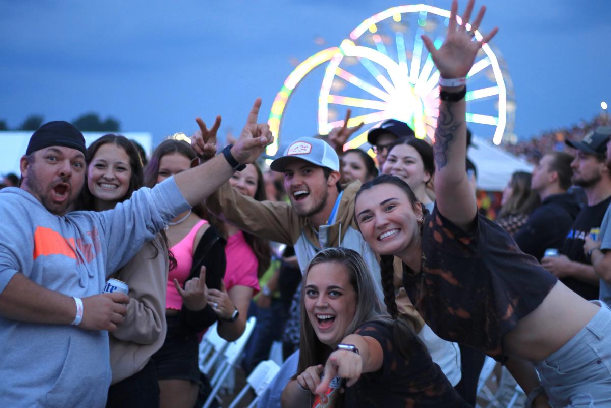 A group of people posing at the Northern WI State Fair live entertainment