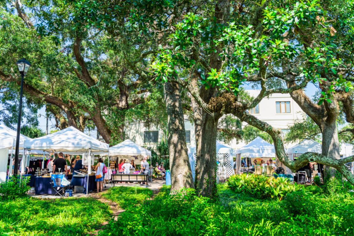 Arts and crafts vendors display handmade goods during an event on St. Simons Island, GA