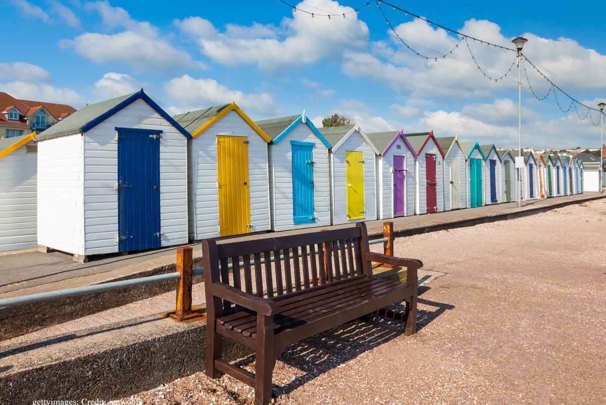Colourful beach huts in Paignton, Devon, during the quieter autumn season