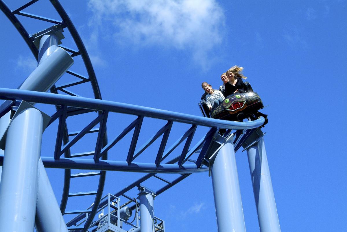 Family riding The Cobra rollercoaster at Paultons Park in the New Forest