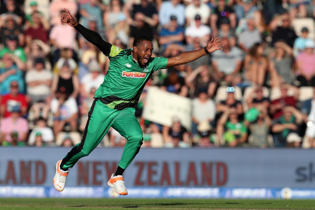 Cricket player jumping for joy on field of The Hundred match
