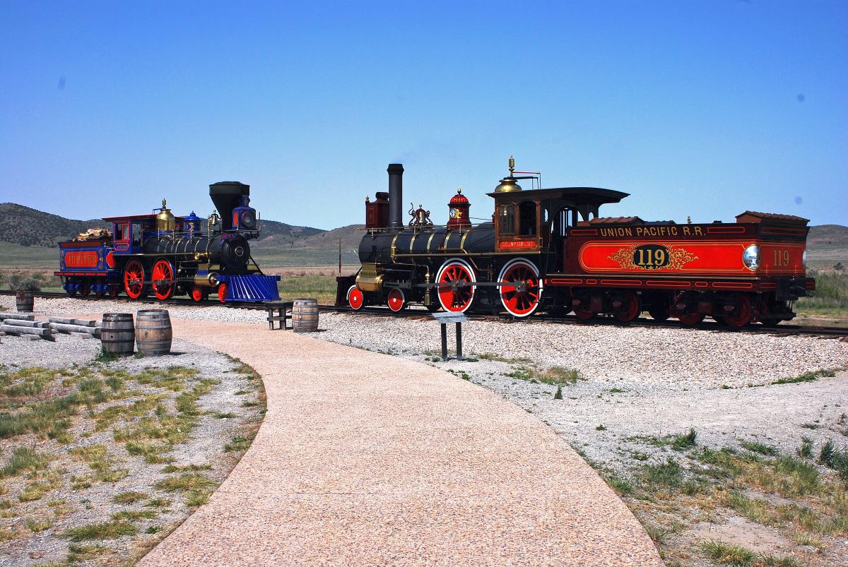 Two old fashioned red coal train engines at Golden Spike Historical Park at Promontory Point