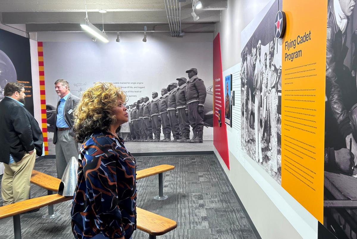 A woman views the Black Aviators exhibit at Kansas Aviation Museum