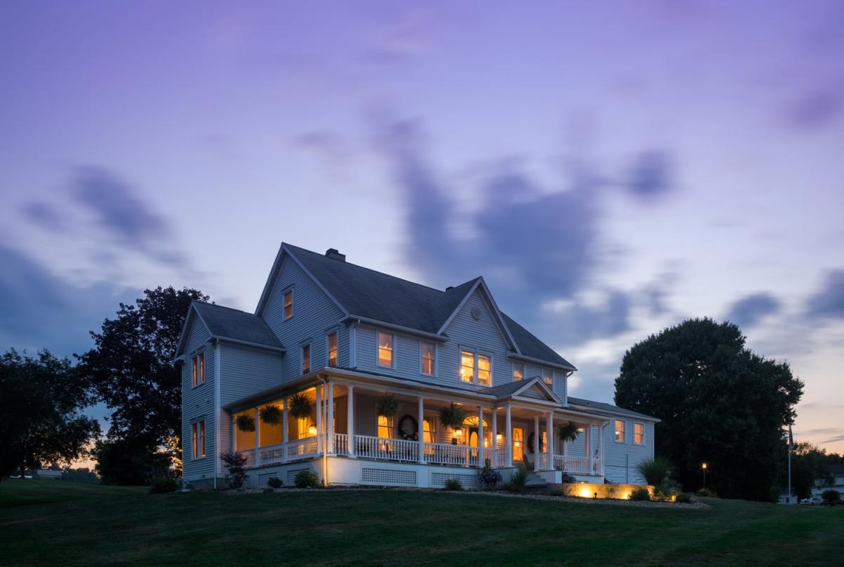 Jacqueline House of Wilmington with purple sky