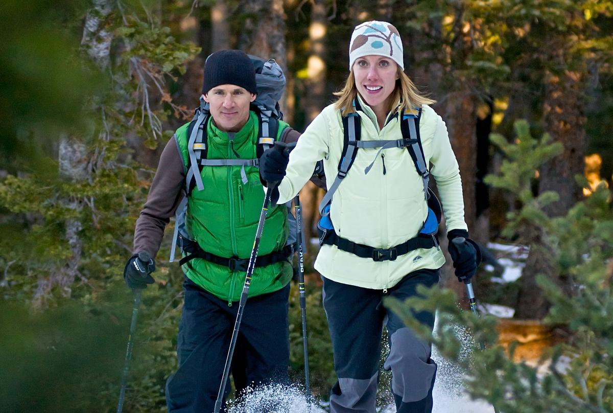 Couple Snowshoeing In Boulder, CO