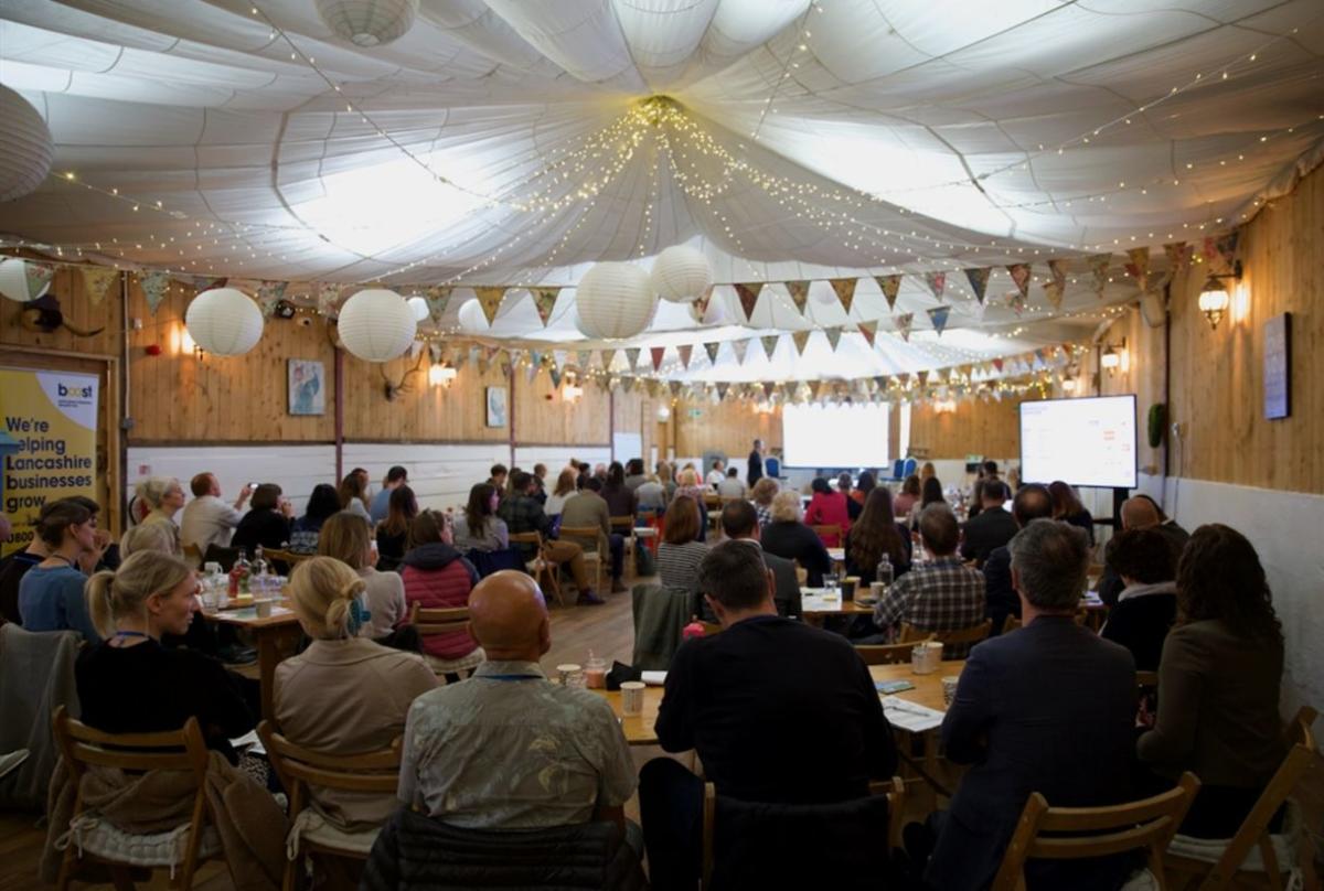 Decorated barn with a large group of people