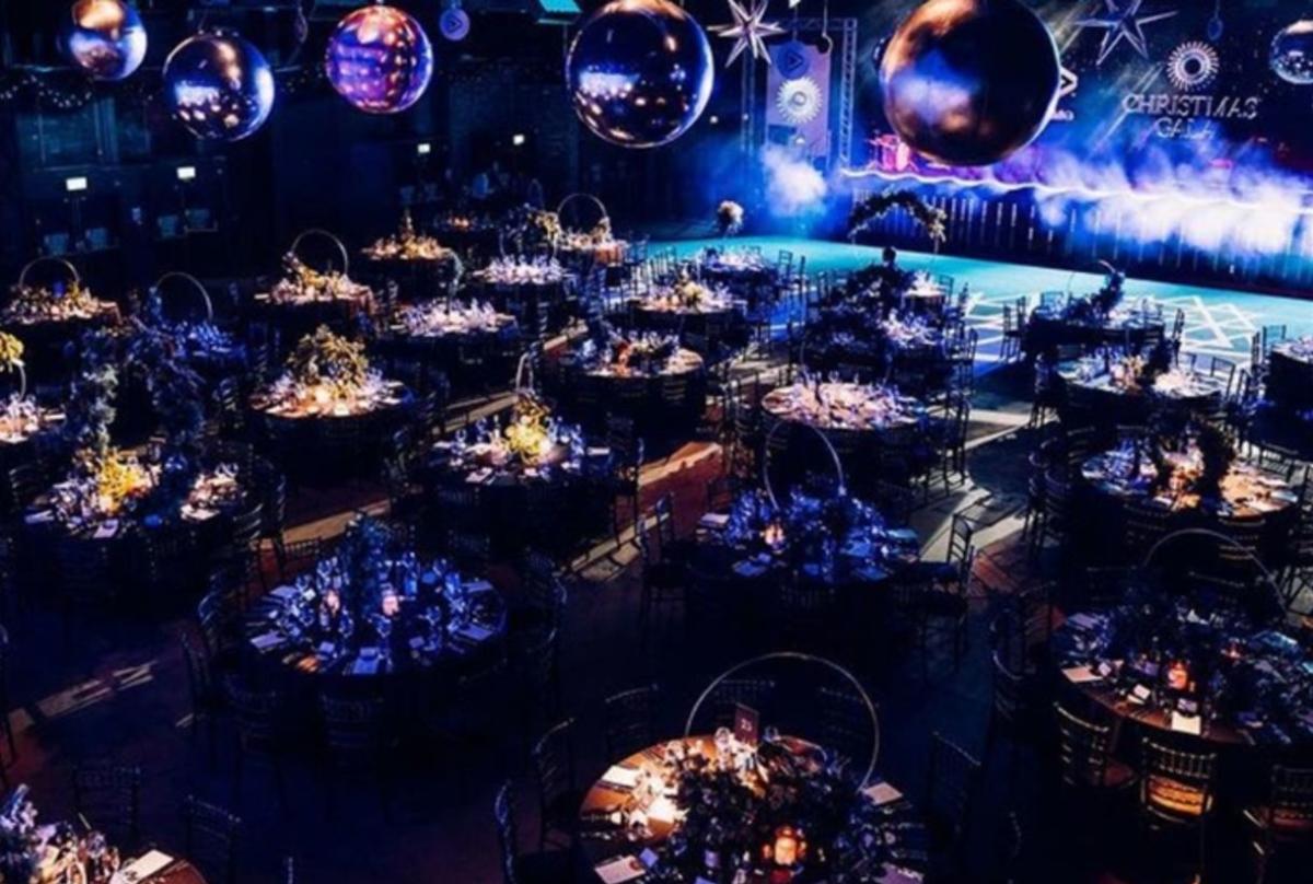 Tables and disco balls inside Victoria Warehouse