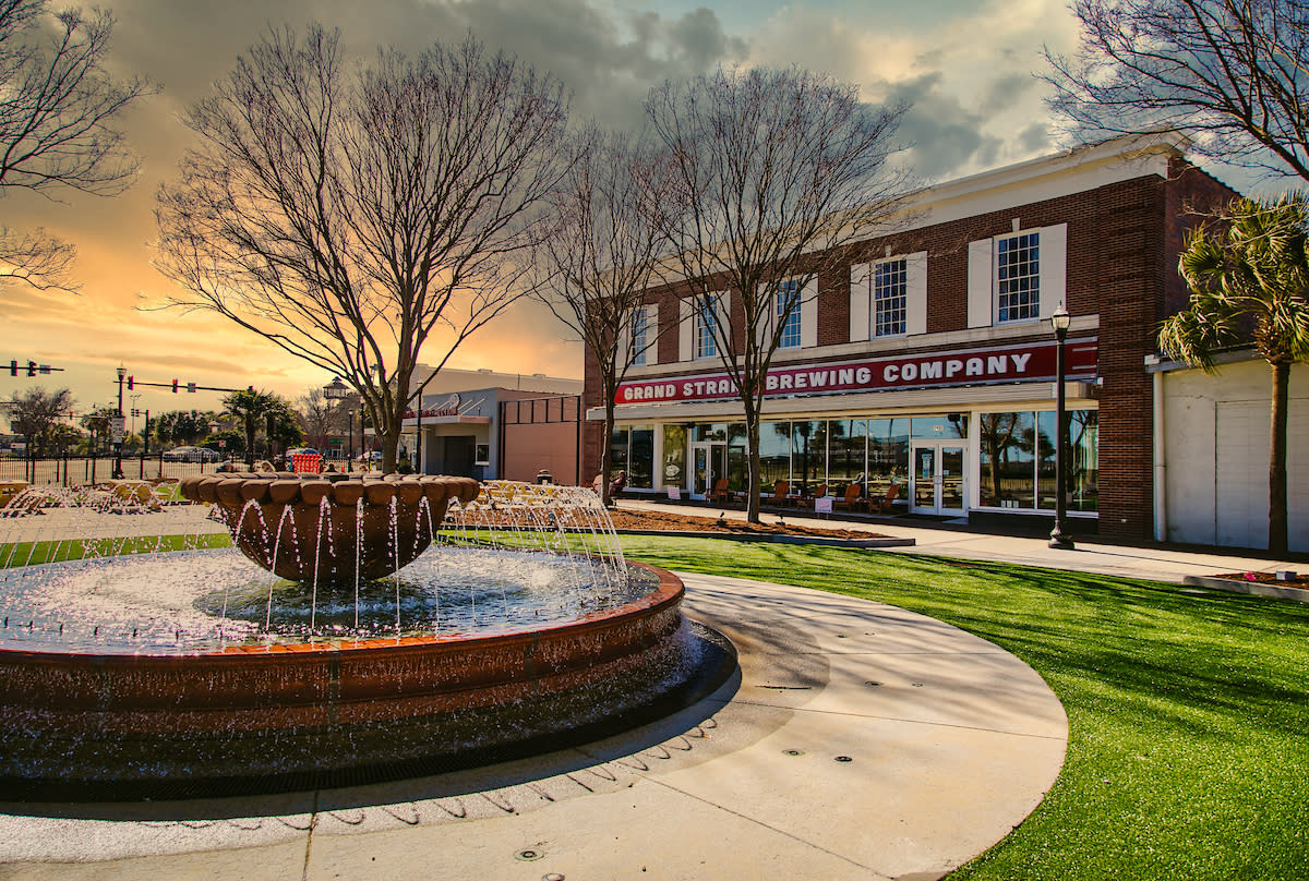 Grand Strand Brewing with fountain and plaza