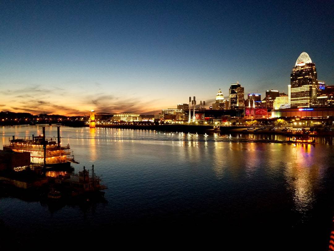 Sunset over the Ohio river with the Cincinnati and BB Riverboat