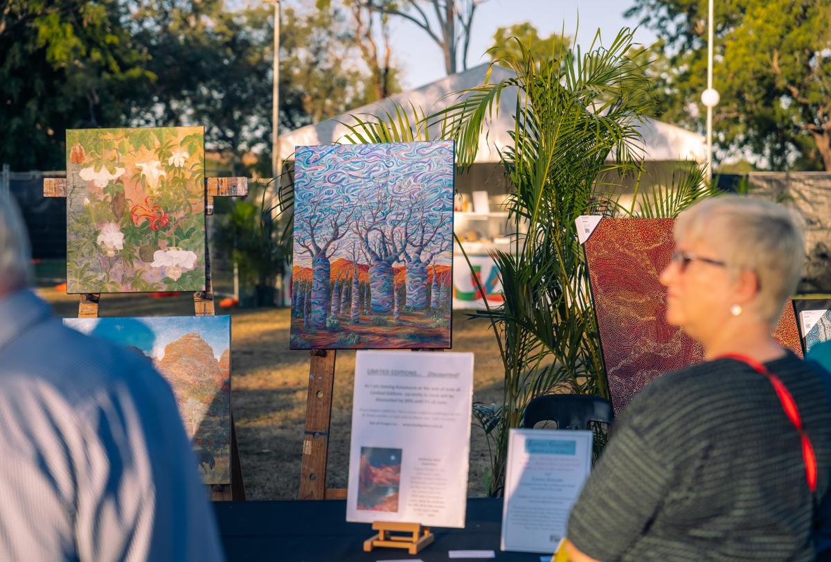 An art show during the Ord Valley muster, with visitors looking at art displayed in the open air