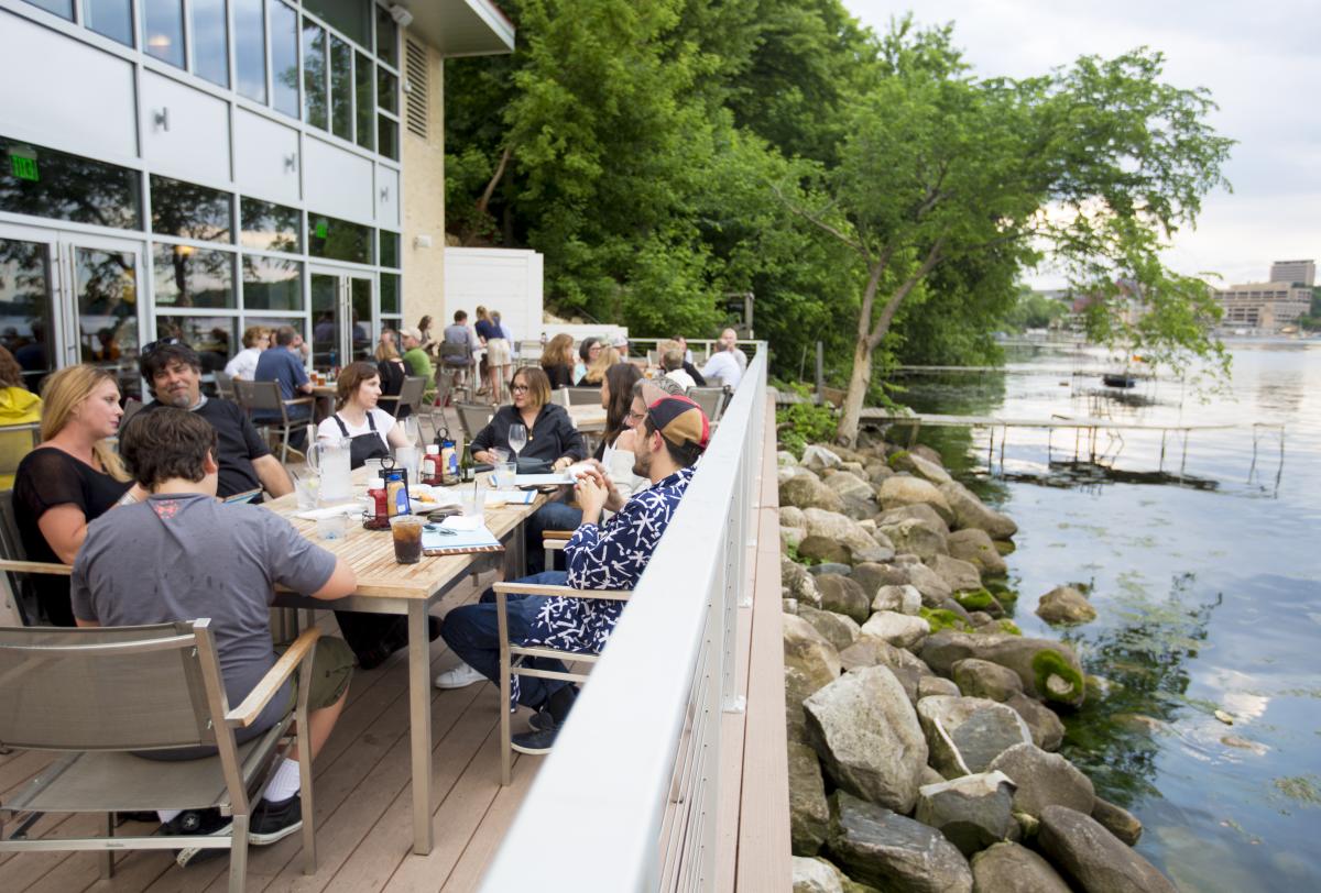 People dine at The Edgewater's Boathouse restaurant on Lake Mendota