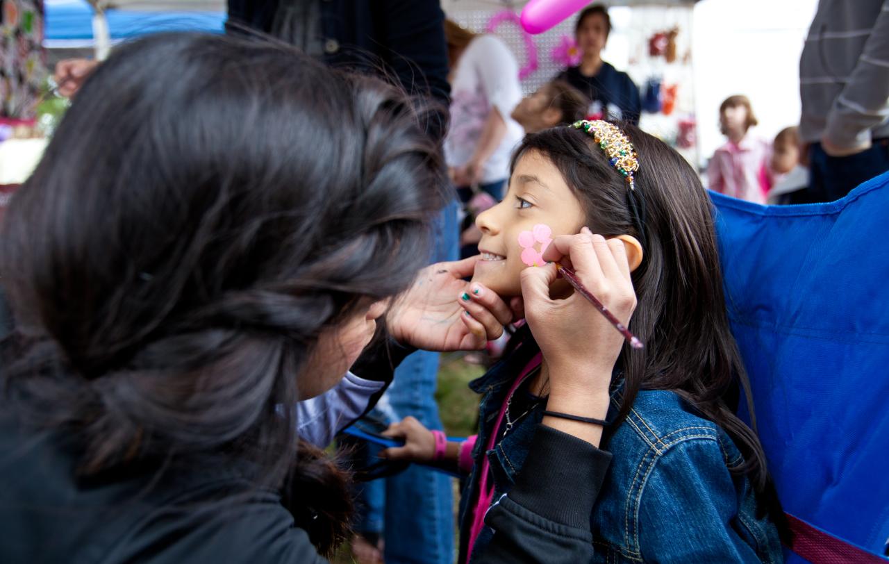 A young girl gets her face painted at the annual Kidsfest in New Braunfels, TX