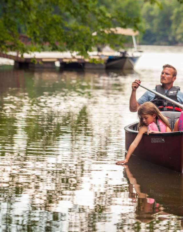 Family in canoe on lake