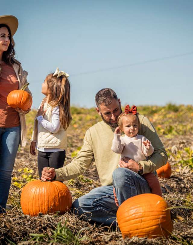 Family Choosing Pumpkins at Patterson