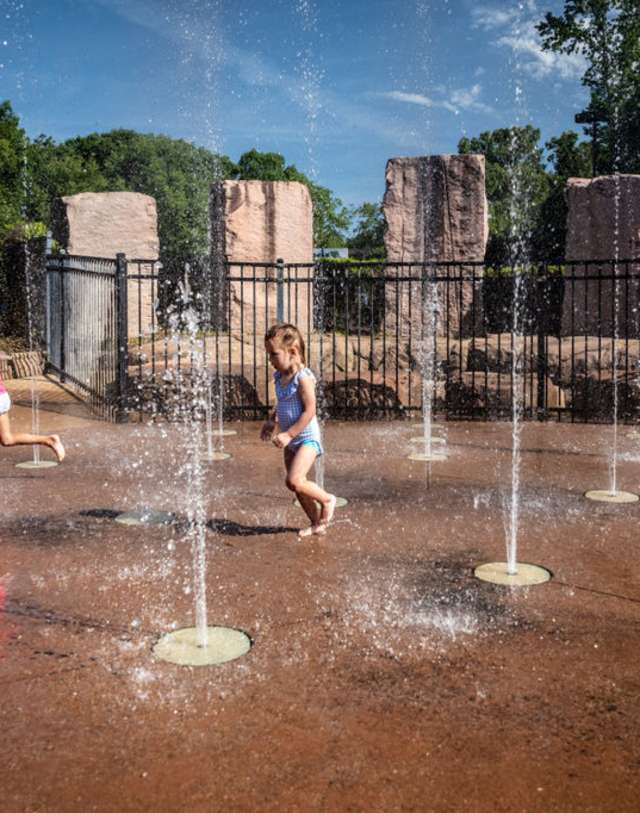 Kids at splash pad at Dan Nicholas Park