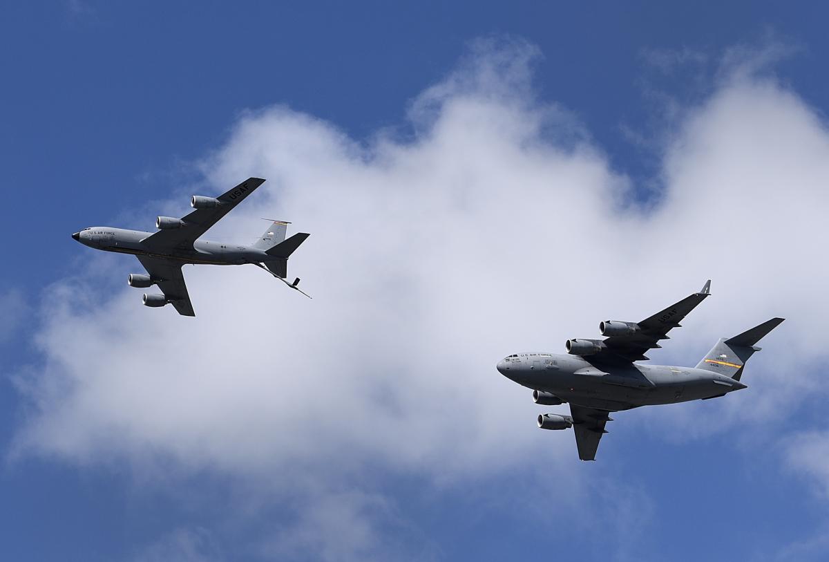 The KC-135 Tanker flies next to the C-17 at the Frontiers in Flight Open House and Air Show at McConnell Air Force Base