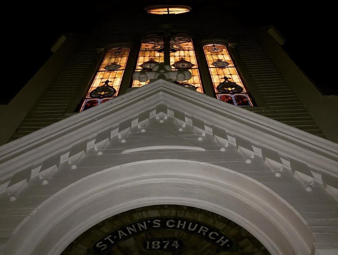Exterior view of Mackinac Island’s St. Ann’s Church at night