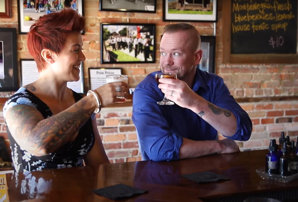 Couple Enjoying Drinks at the Bar at Revival 1869 Drinkery in Clayton, NC.