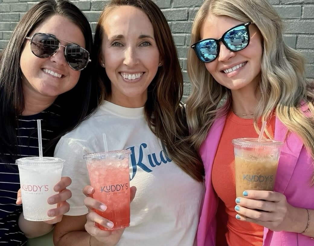 ladies with drinks from kuddy's located in the assembly in downtown elizabethtown