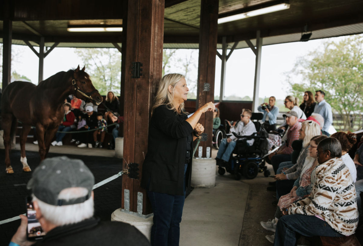 Woman signing to crowd at KY Horse Park