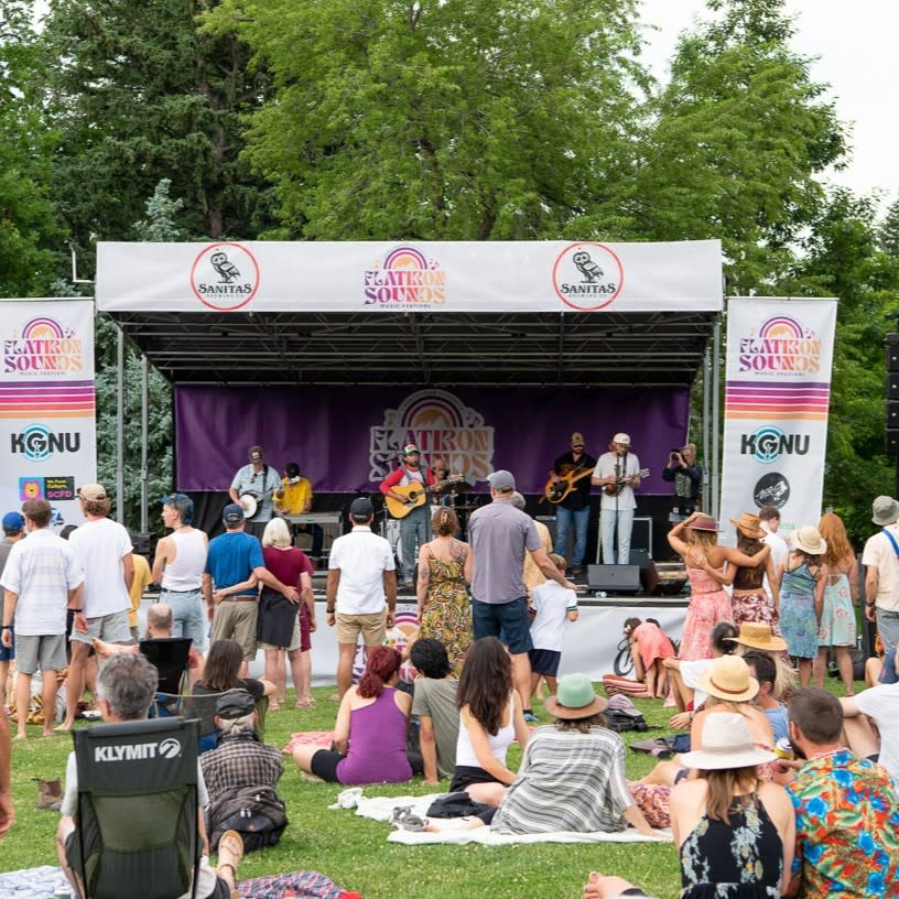 Flatirons Sounds Festival outdoor stage and band with audience in front