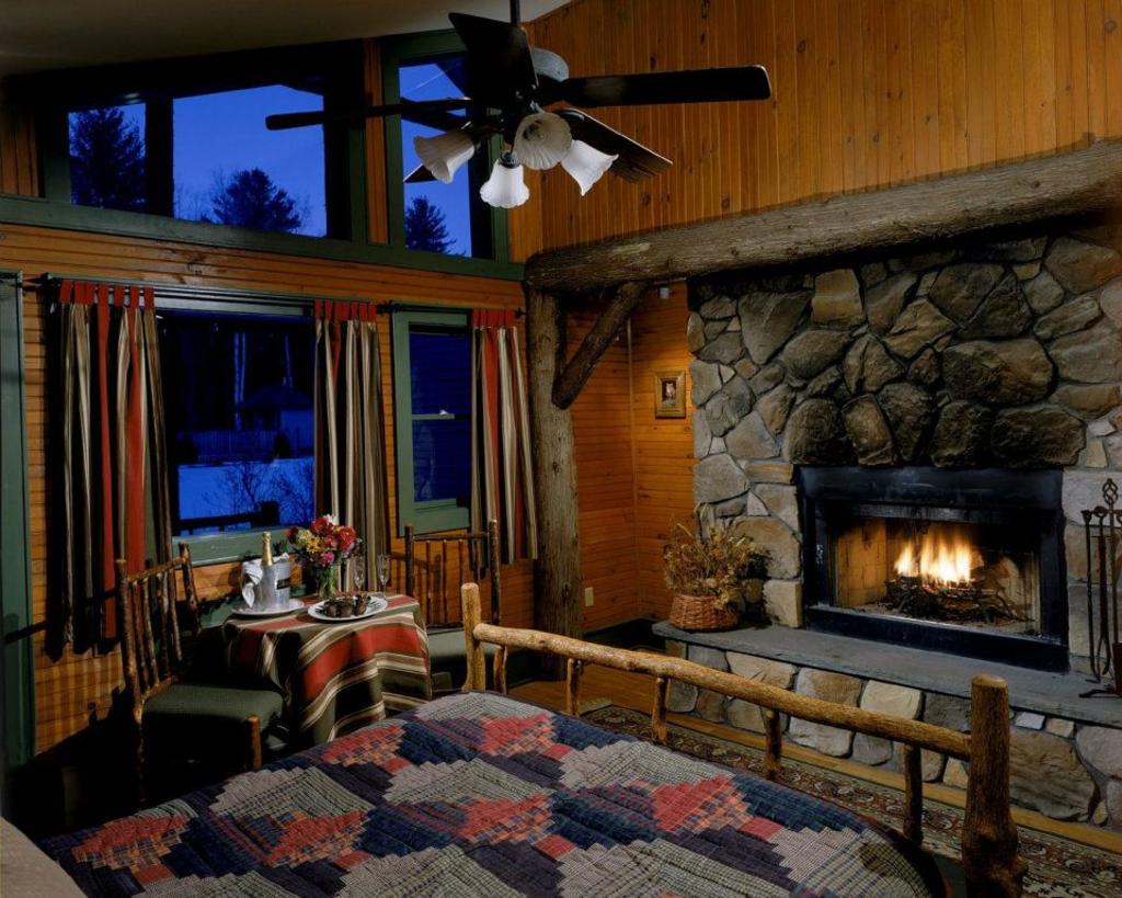 Friends Lake Inn bedroom with fireplace