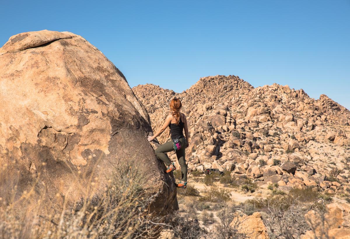 Woman rock climbing in Joshua Tree National Park