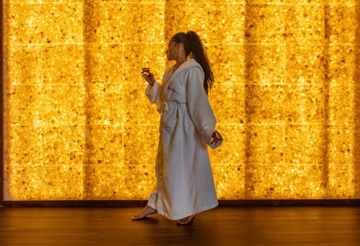 Aarna Spa Salt Room. Girl enjoying the salt room in her robe.