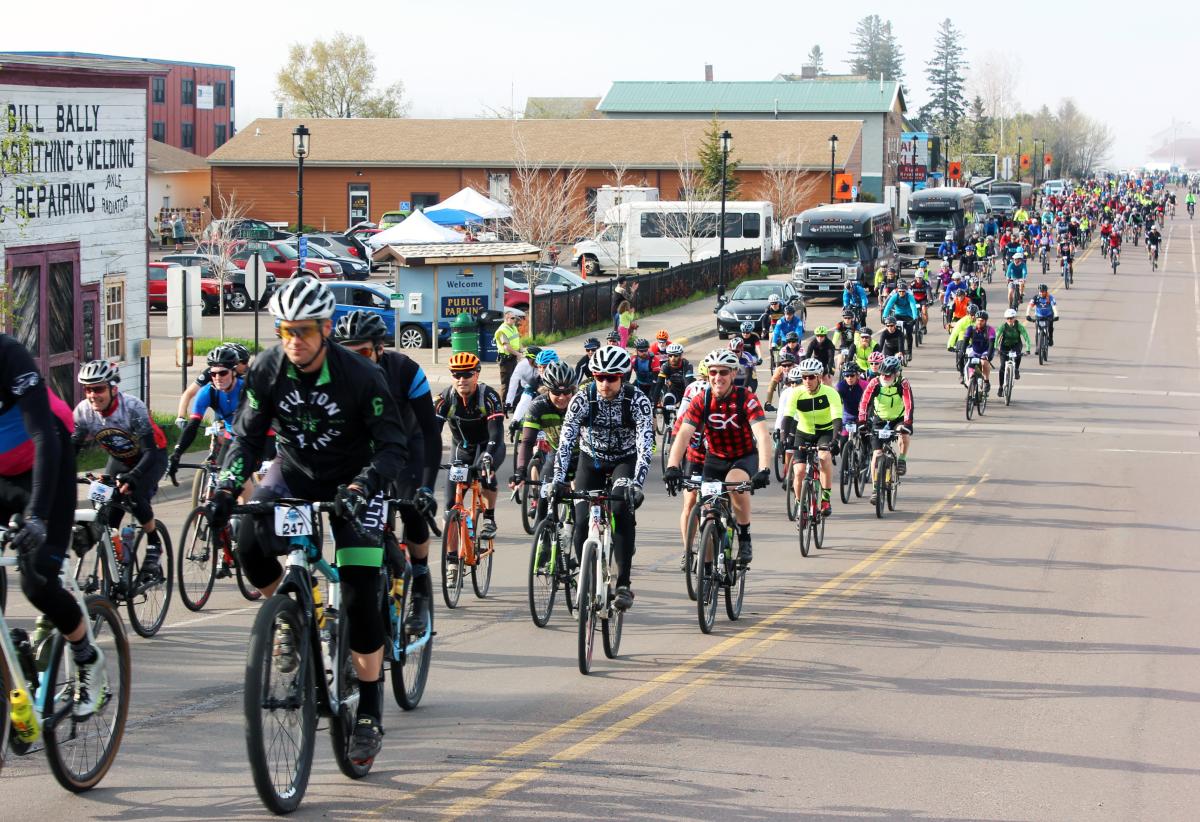 A group of cyclists heading out on a race course.