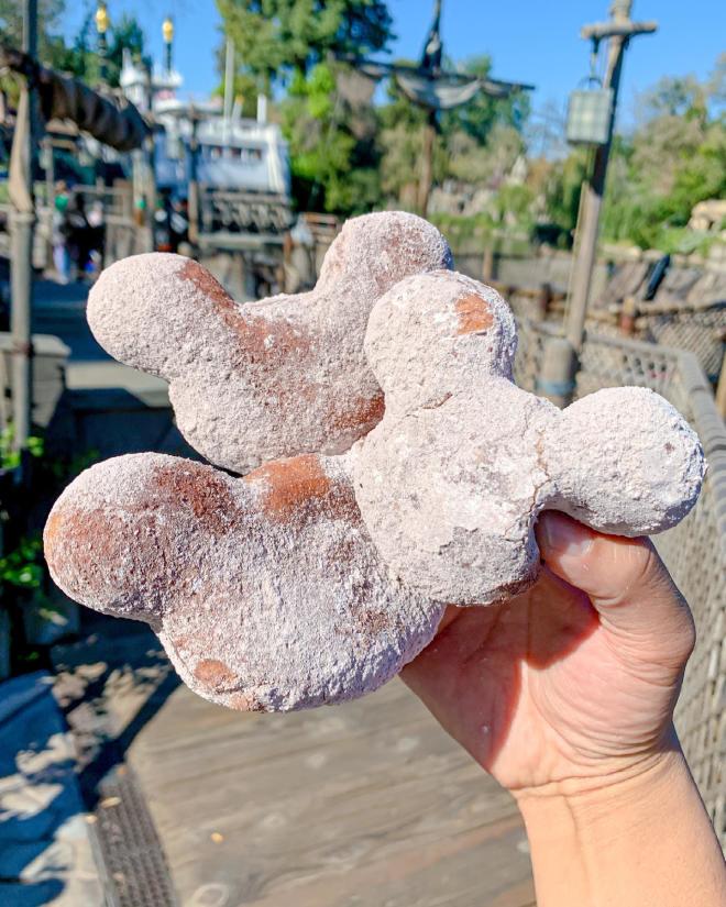 Image of three Mickey-shaped beignets.