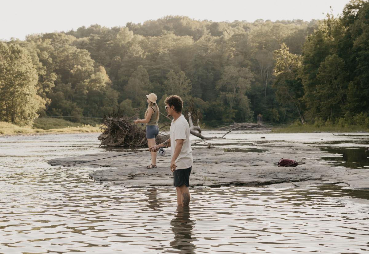 People Fishing by Water