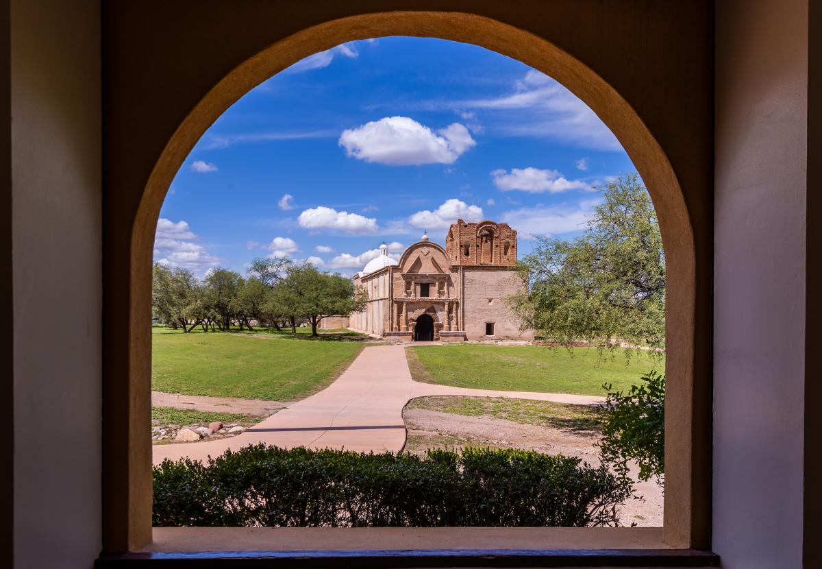 a lone, old Spanish building in a field