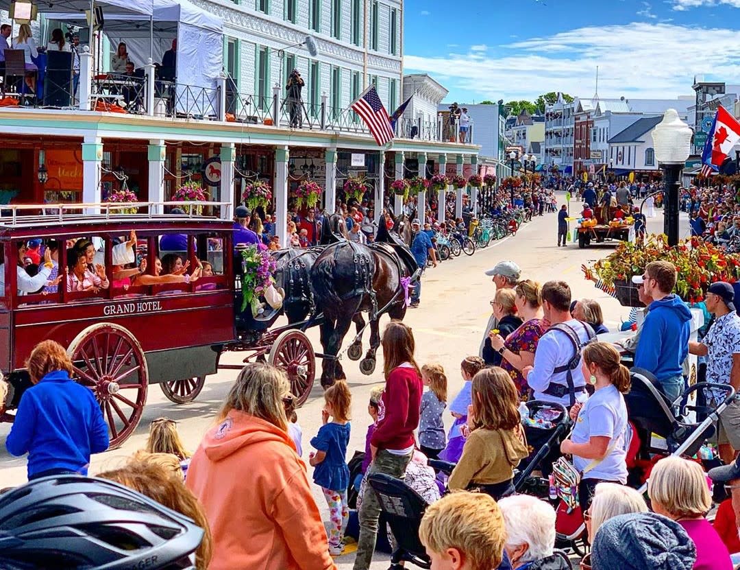 Crowds line both sides of Main Street during the annual Mackinac Island Lilac Festival parade