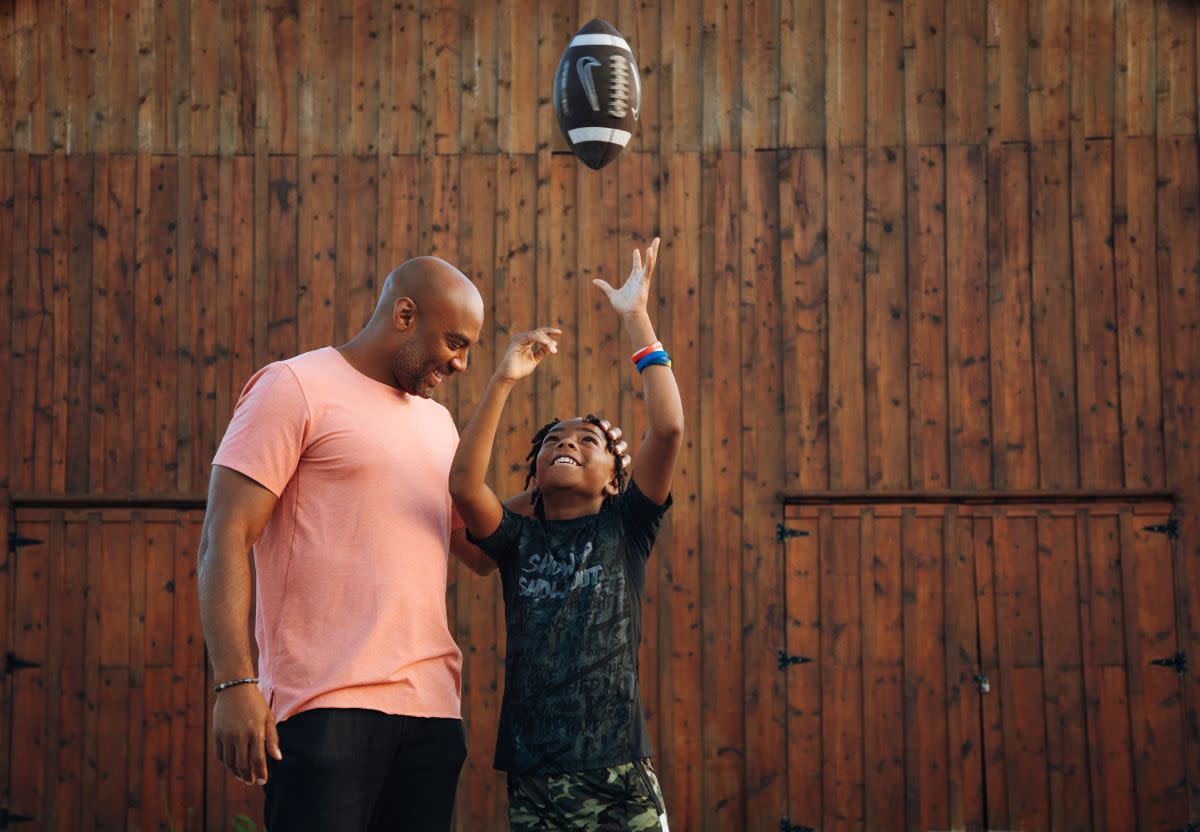 George Wilson standing with his son