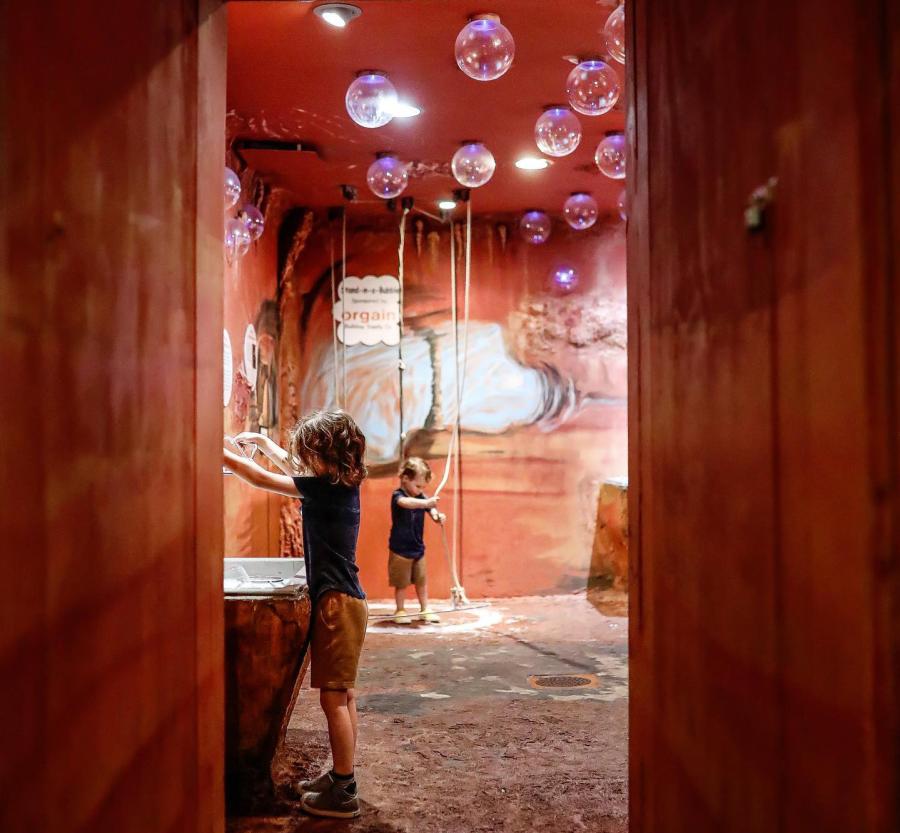 boys playing in a bubble cave