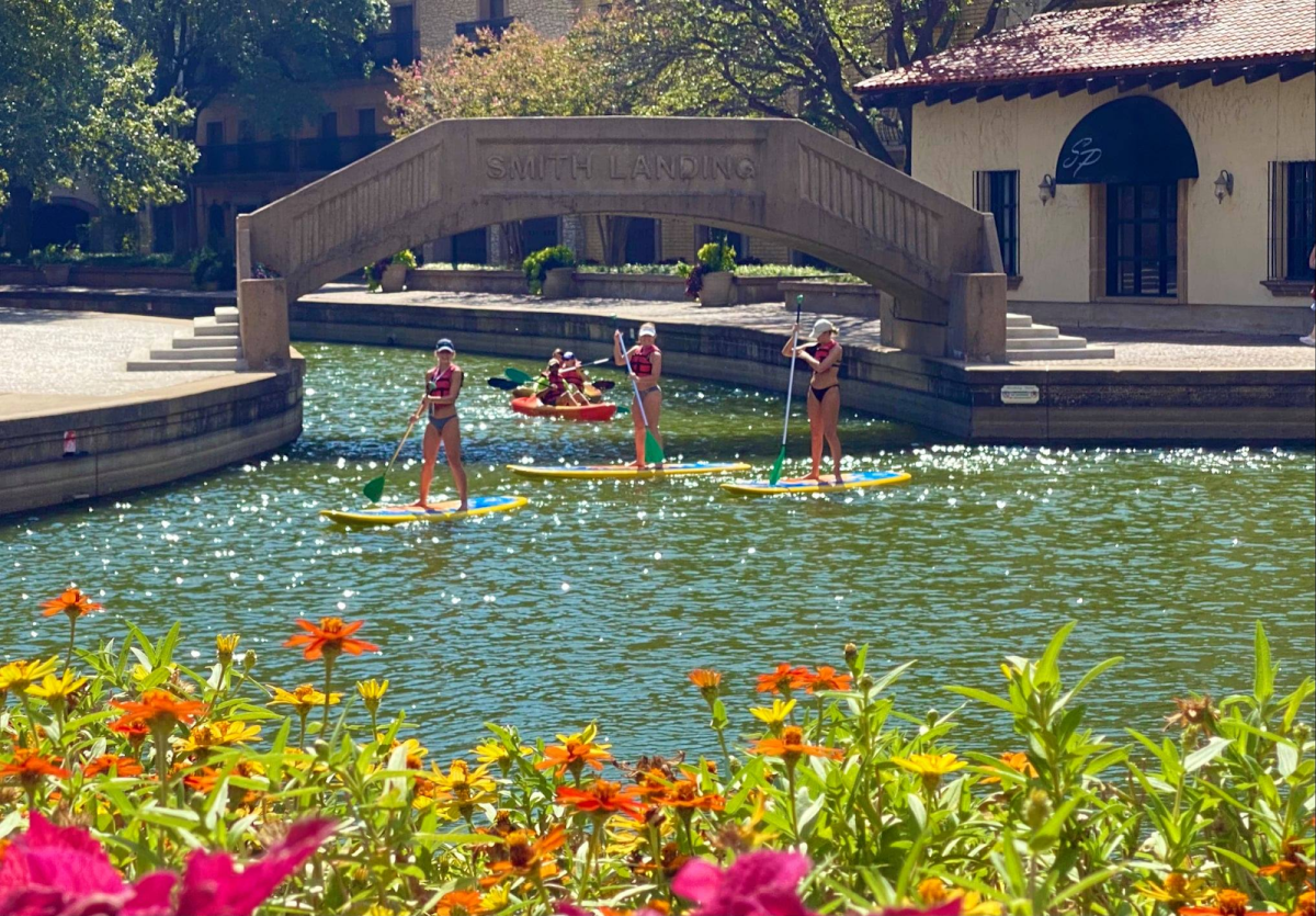 People paddle boarding near Lake Carolyn In Irving, TX