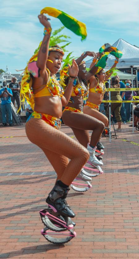 African dancers dance at a festival in unison