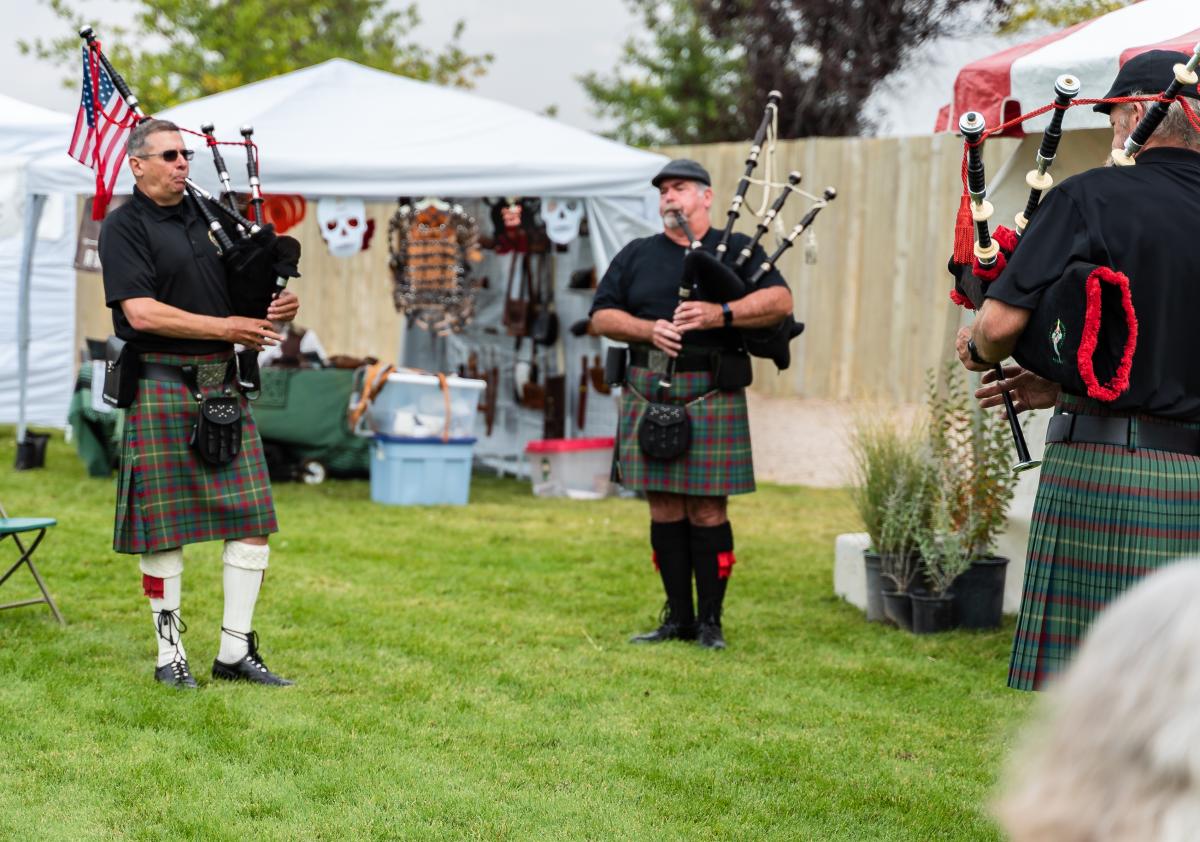 Three men play the bag pipes at the Celtic Festival.
