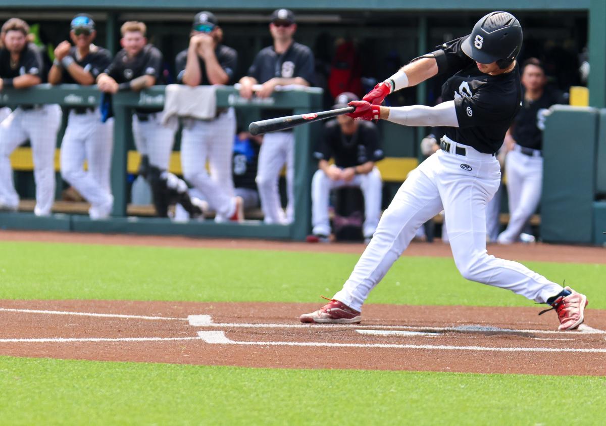 A WSU Baseball player hits a ball during a game at Eck Stadium.