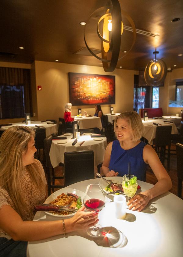 Two mom friends dinign at Perry's Steakhouse