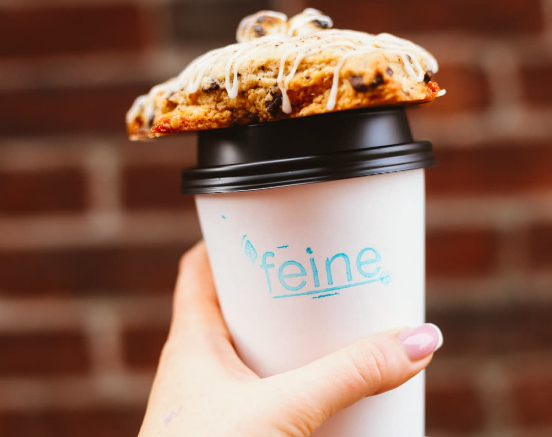 A cup of hot chocolate and a pastry at 'Feine