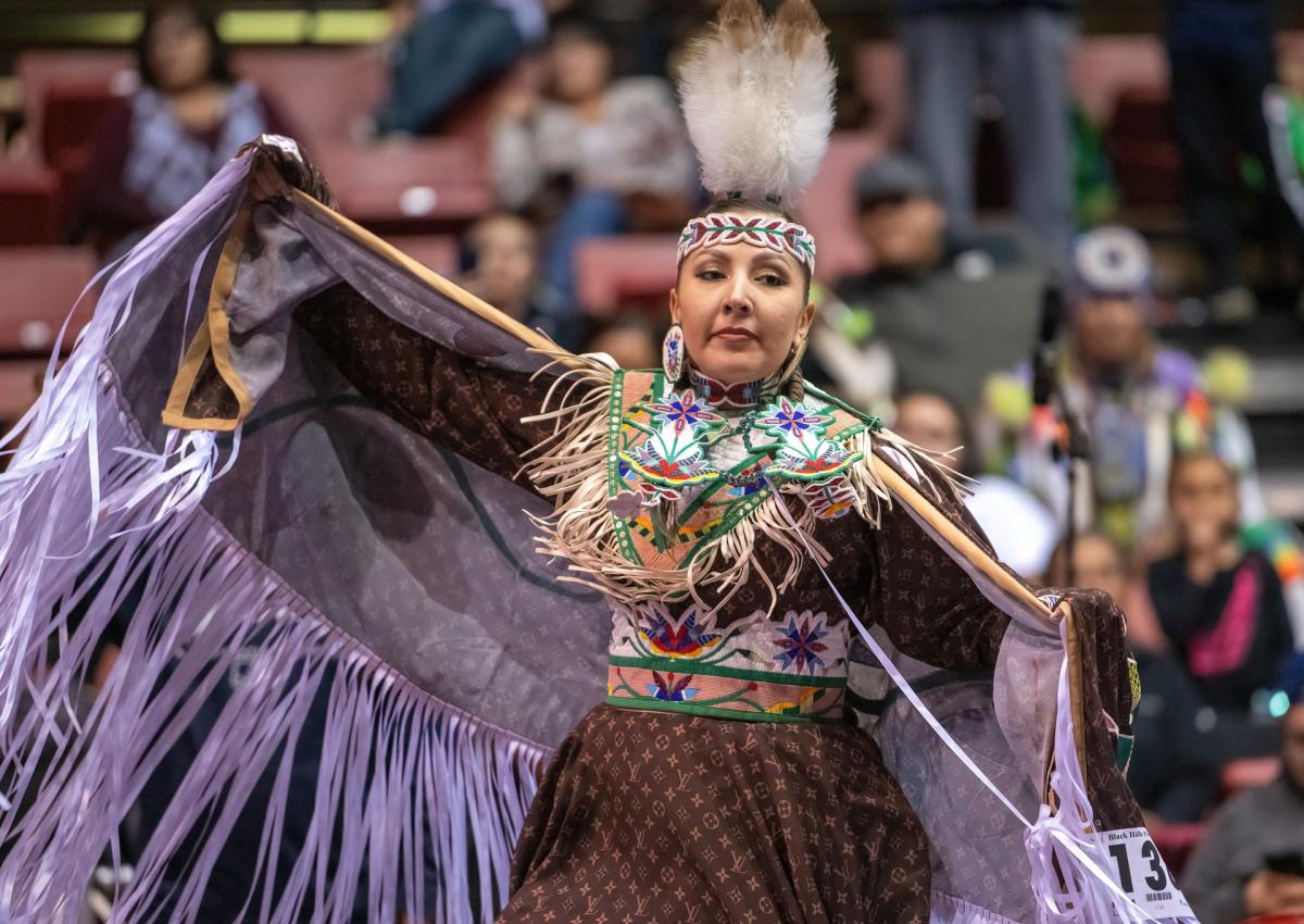 women's fancy shall dancer at the black hills powwow in rapid city, sd